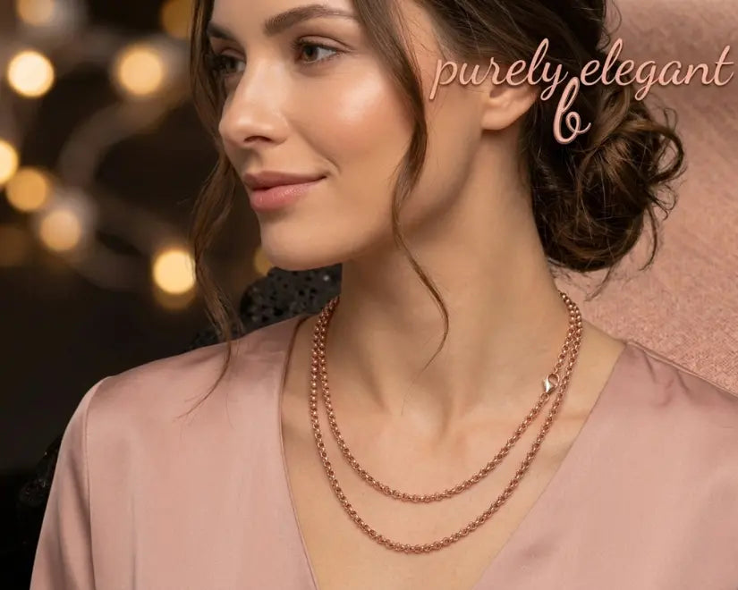 Woman wearing a necklace with 'purely elegant' branding in the background