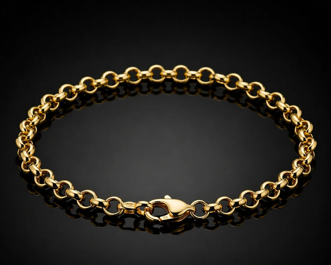 Gold chain bracelet on a black background