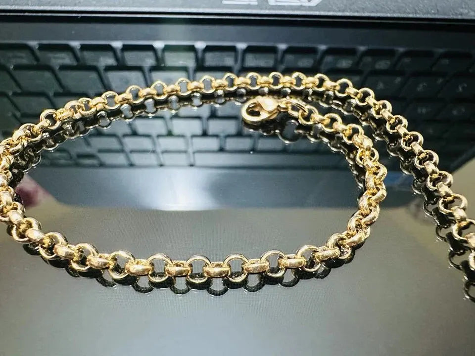 Gold chain on a laptop keyboard