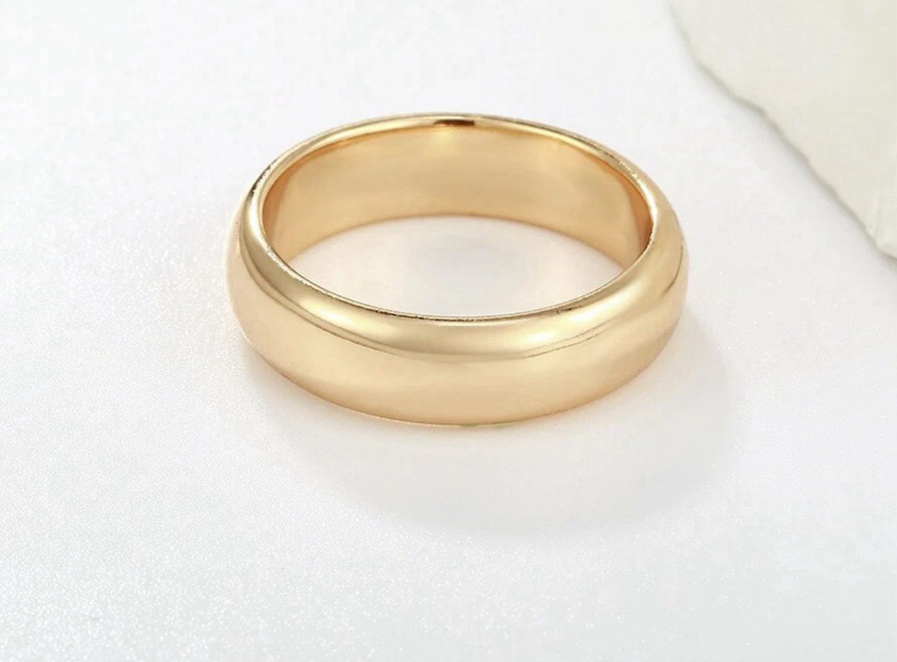 Gold ring on a white background