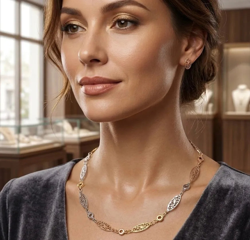 Woman wearing a gold necklace in a jewelry store setting