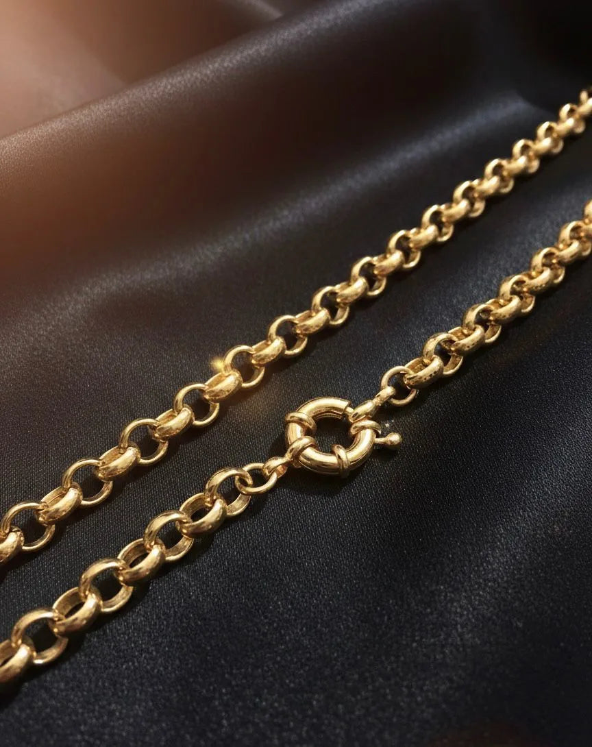 Gold chain on a dark fabric background