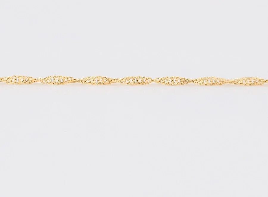 Gold chain Anklets  on a light gray background