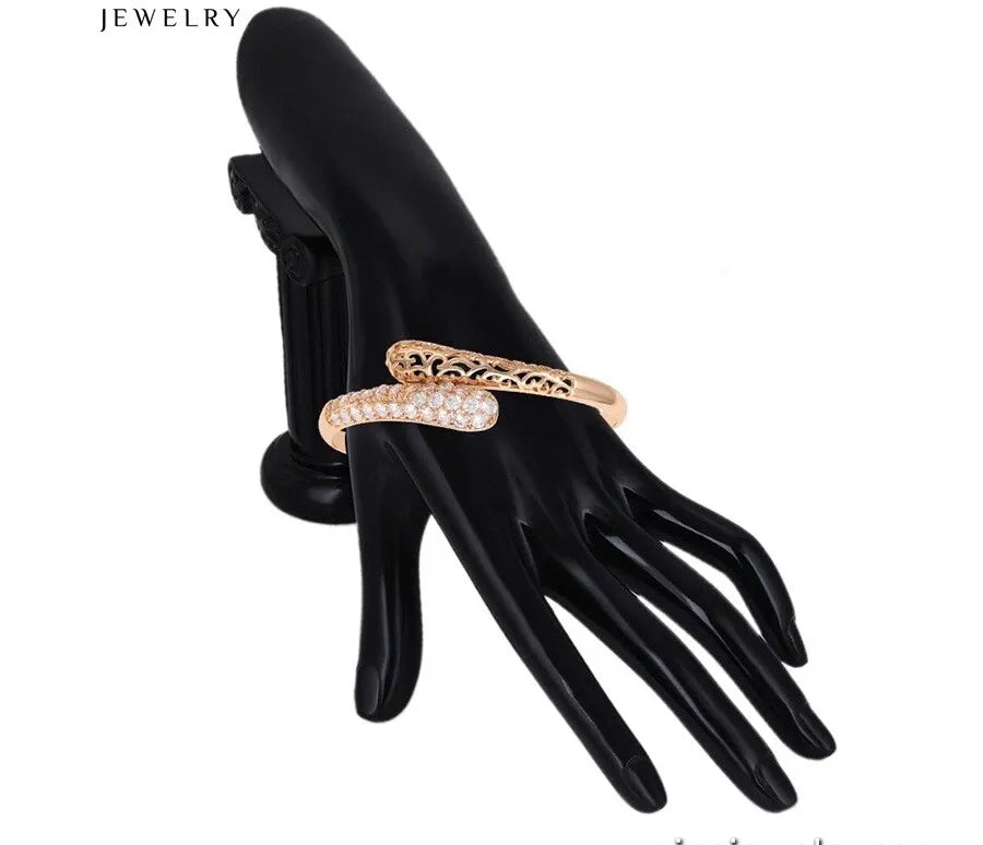  gold ring with clear stones on a black mannequin hand, labeled 'JEWELRY'.