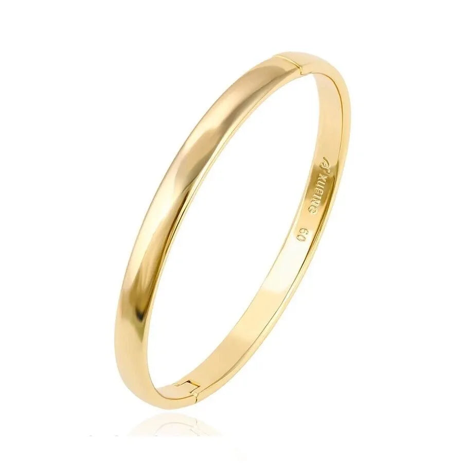 Gold bangle on a white background