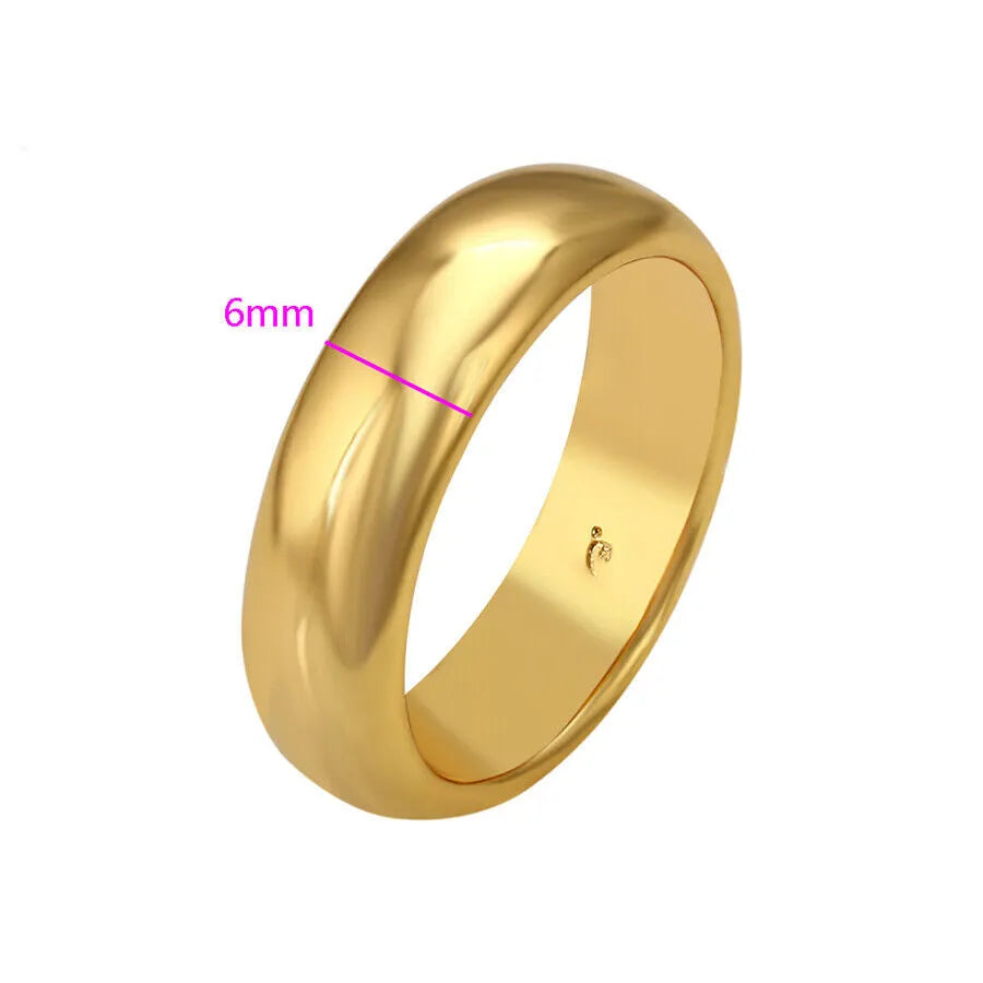 Gold ring with a width of 6mm on a white background