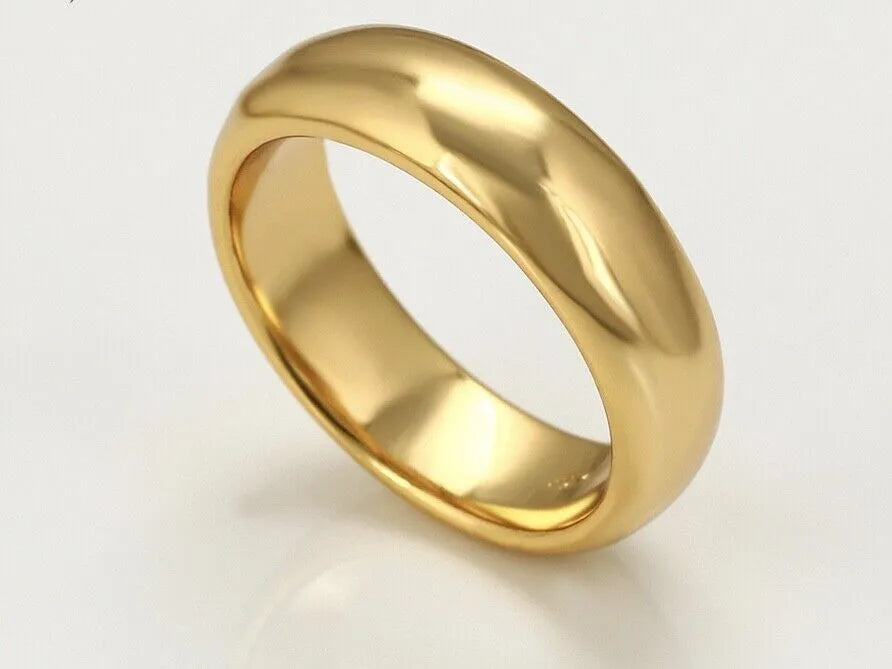 Gold ring on a light gray background