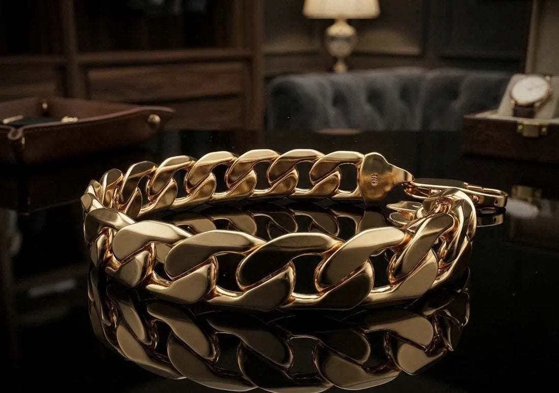 Gold chain bracelet on a reflective surface with a blurred background