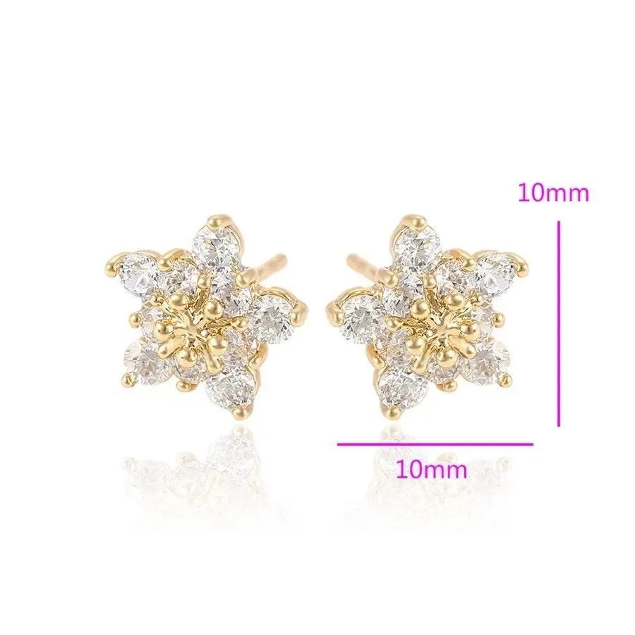 Gold and diamond flower-shaped earrings with size measurement on a white background