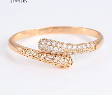  gold bracelet with diamond accents on a white background