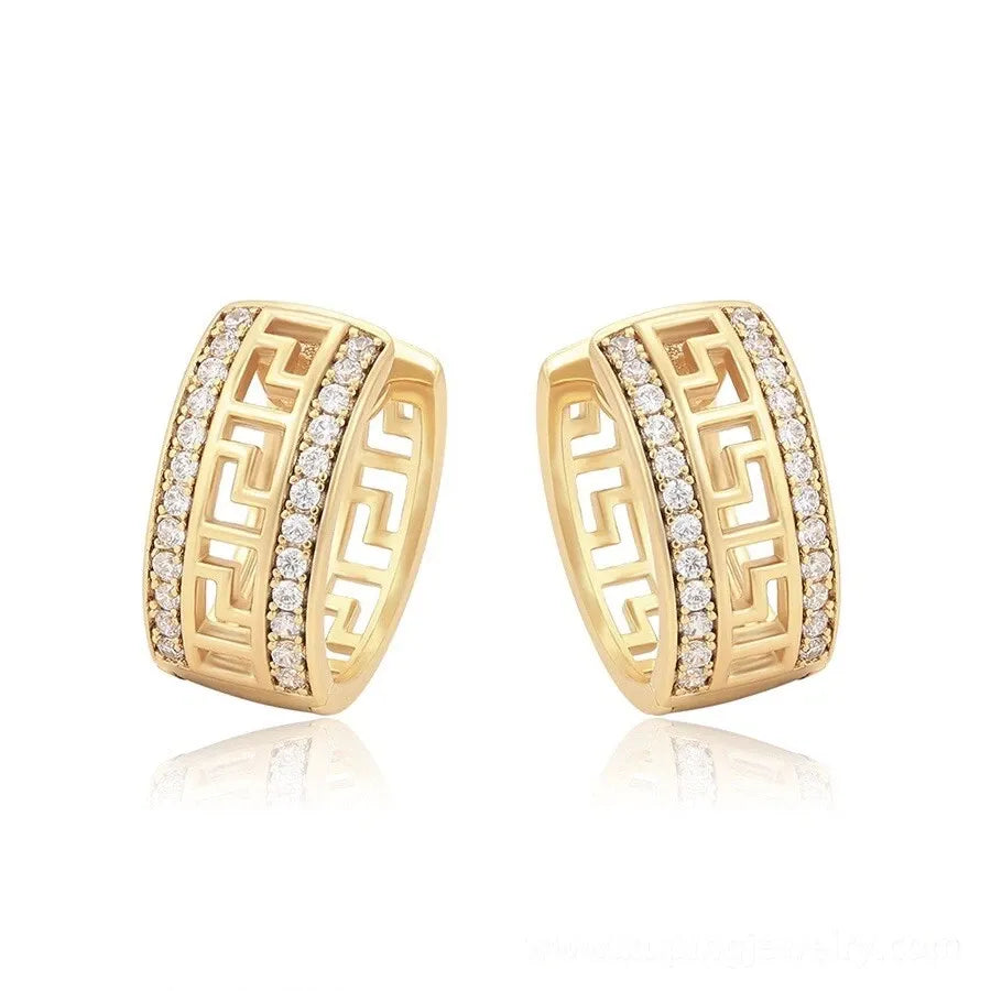 Gold hoop earrings with diamond accents on a white background