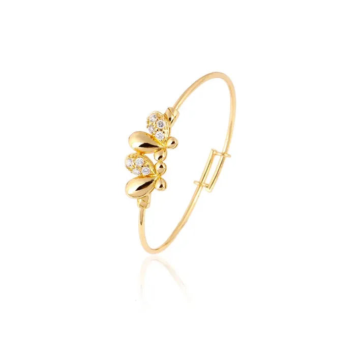 Gold bracelet with floral design on a white background