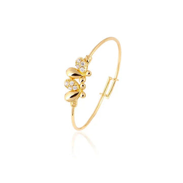 Gold bracelet with floral design on a white background