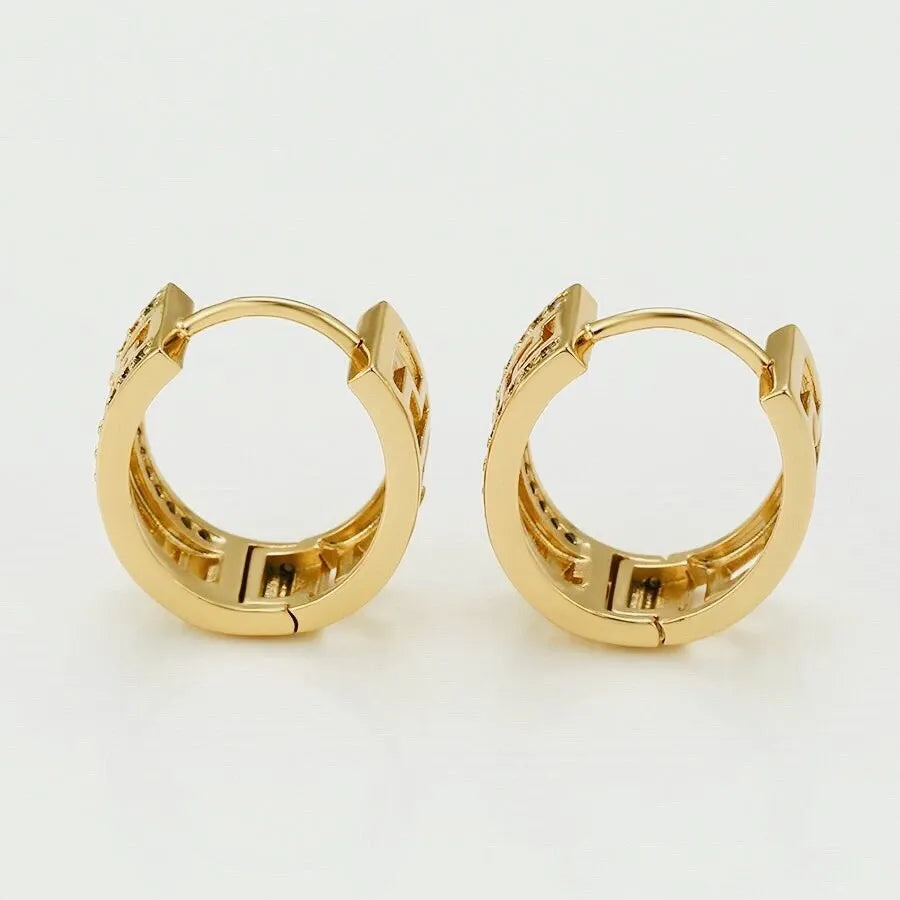 Gold hoop earrings on a white background