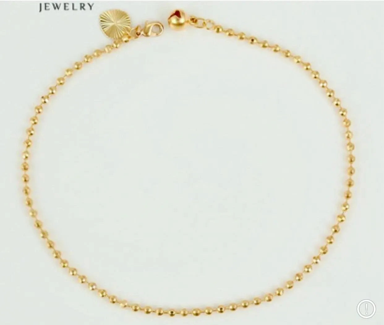 Gold bracelet on a light gray background with 'Jewelry' text above.