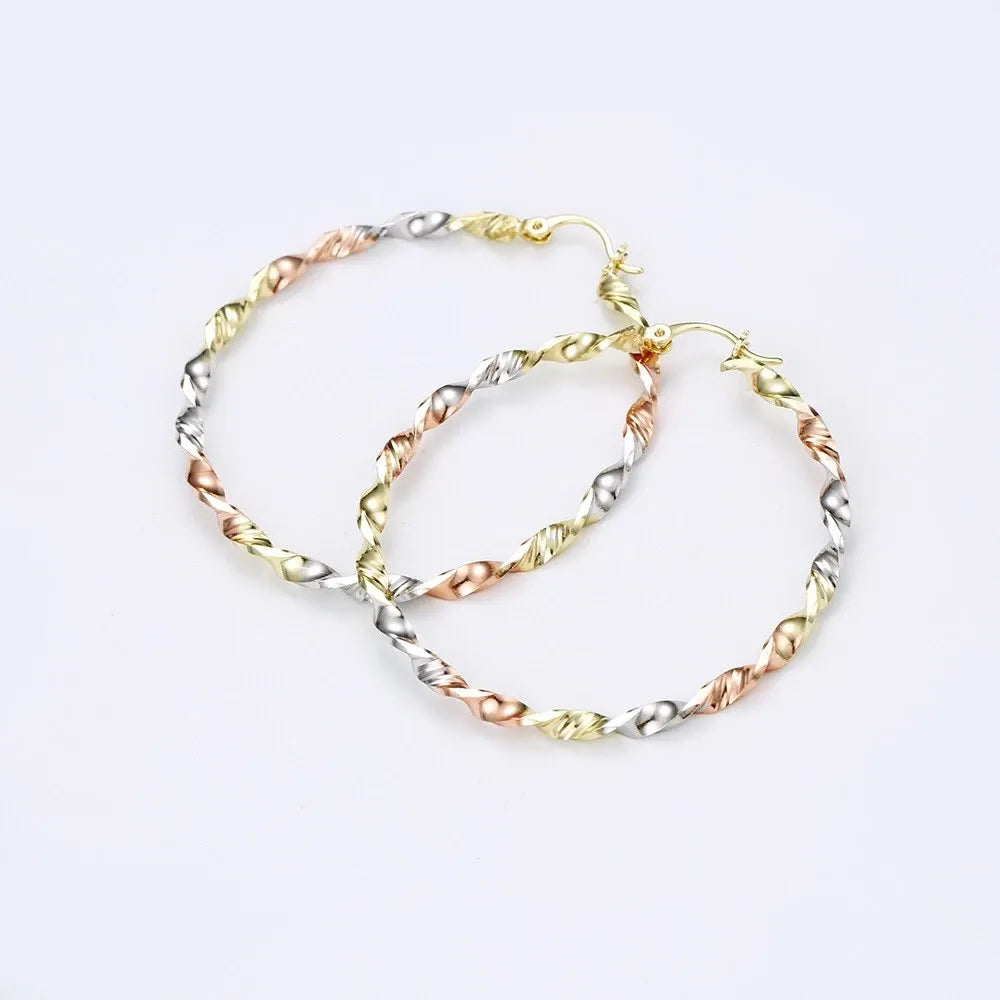 Pair of gold hoop earrings on a white background