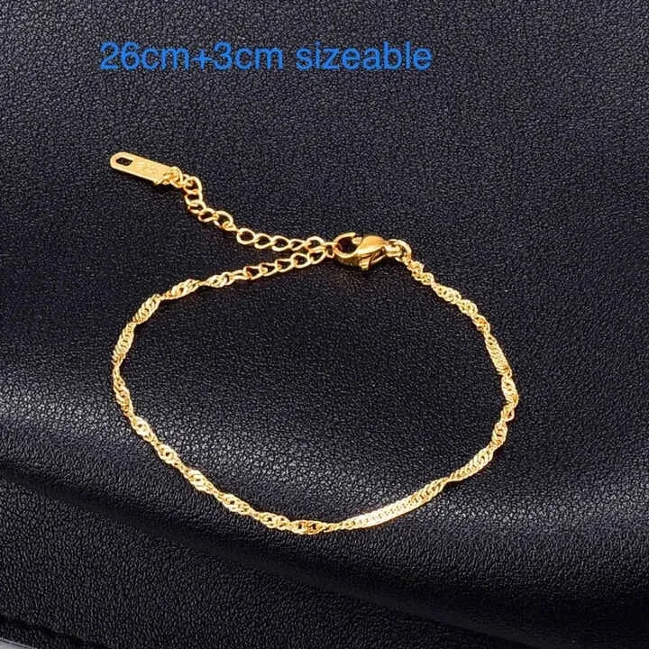 Gold chain Anklets on a black textured background with size information.