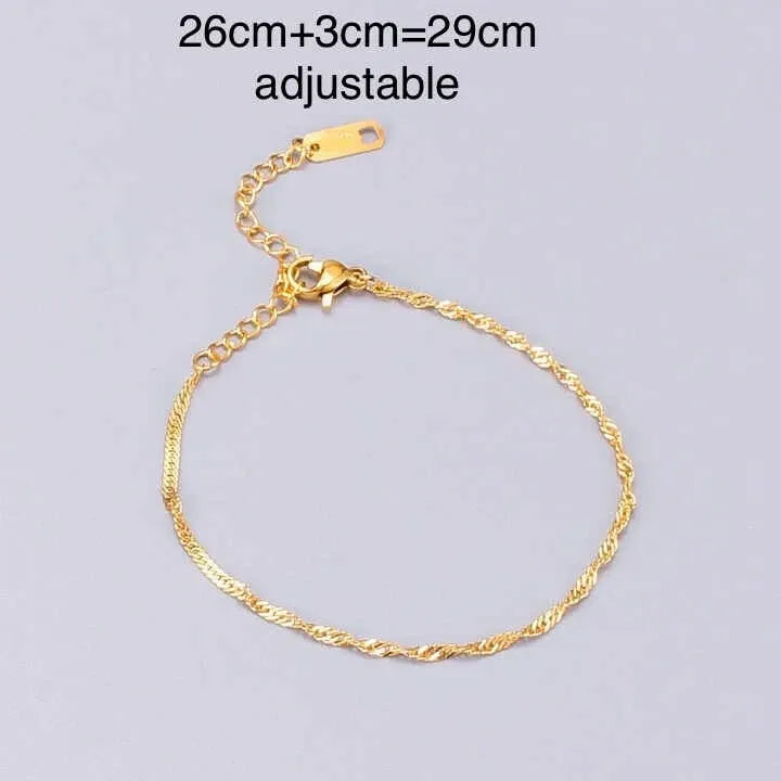 Gold Anklets with adjustable clasp on a light gray background