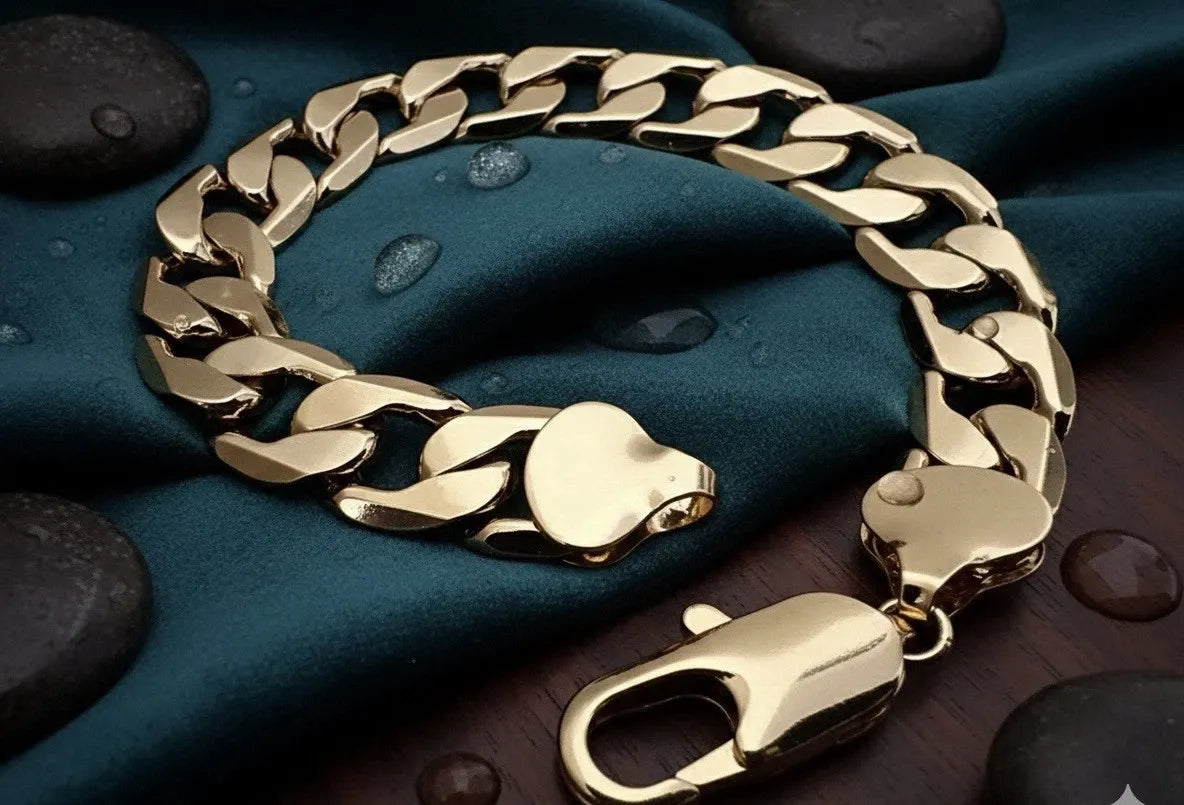 Gold chain bracelet on a textured surface