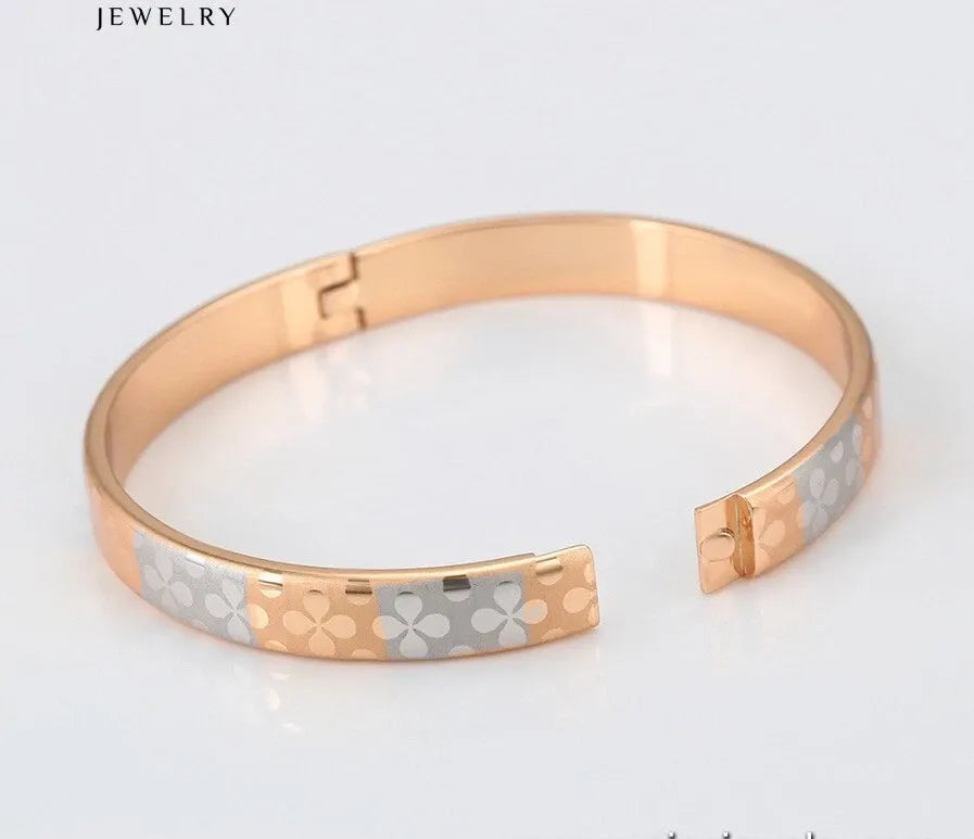 Rose gold and silver bracelet on a light gray background with 'JEWELRY' text.