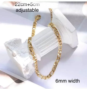 Gold chain necklace with adjustable length and 6mm width on a white marble surface