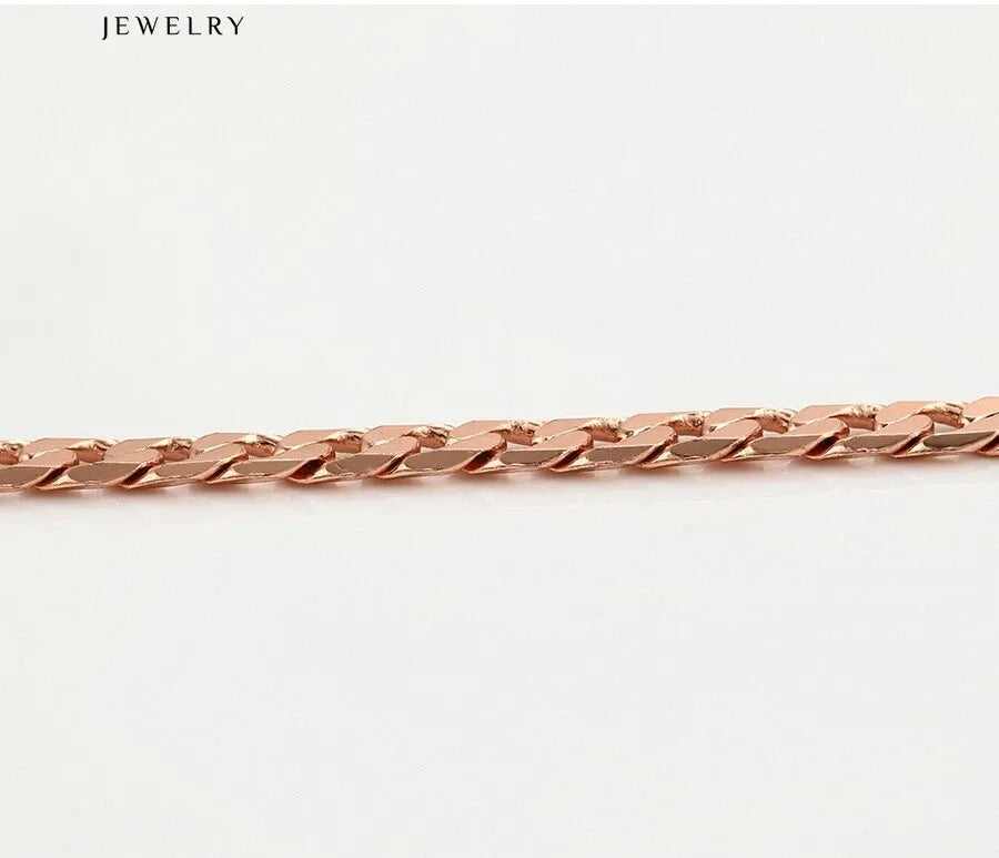 Rose gold chain on a white background with 'JEWELRY' label.