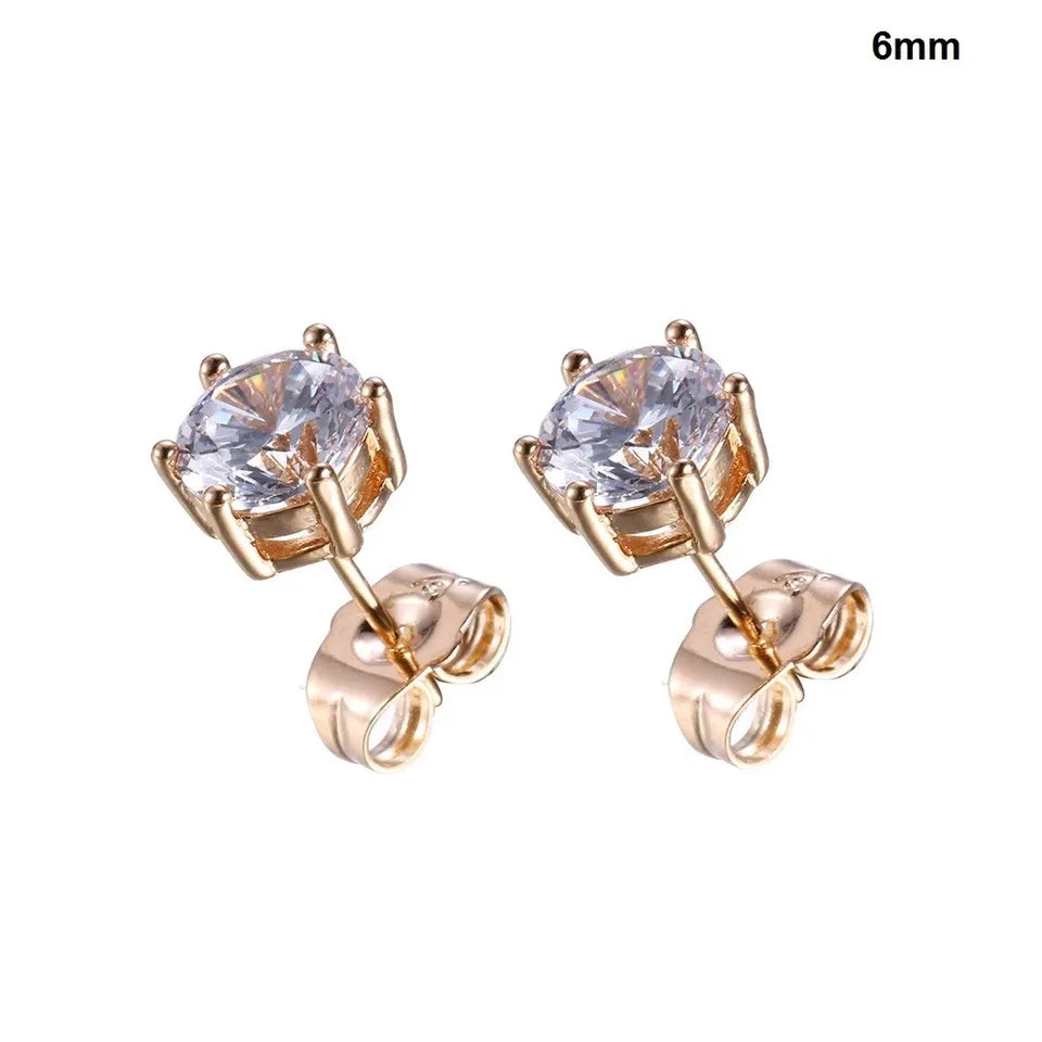 Rose gold stud earrings with clear gemstones on a white background