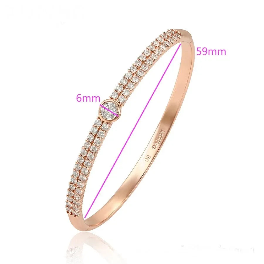 Rose gold bracelet with measurements on a white background
