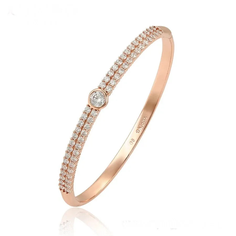 Rose gold bracelet with diamonds on a white background