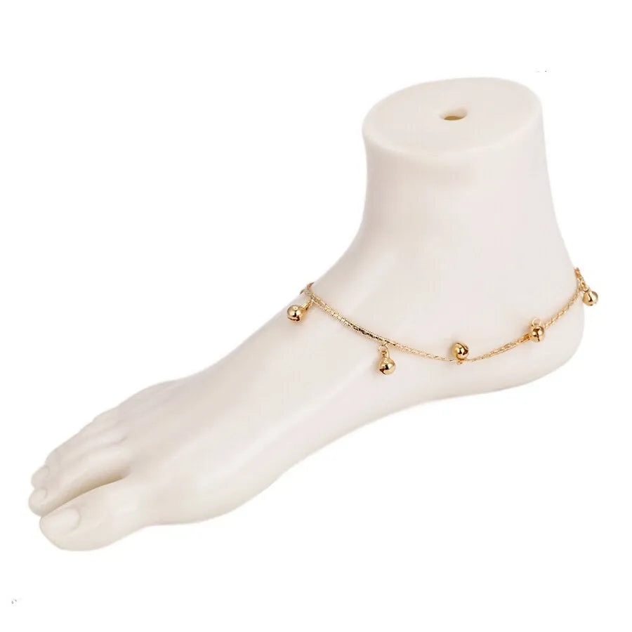 Gold  Anklet with small gold beads on a white background