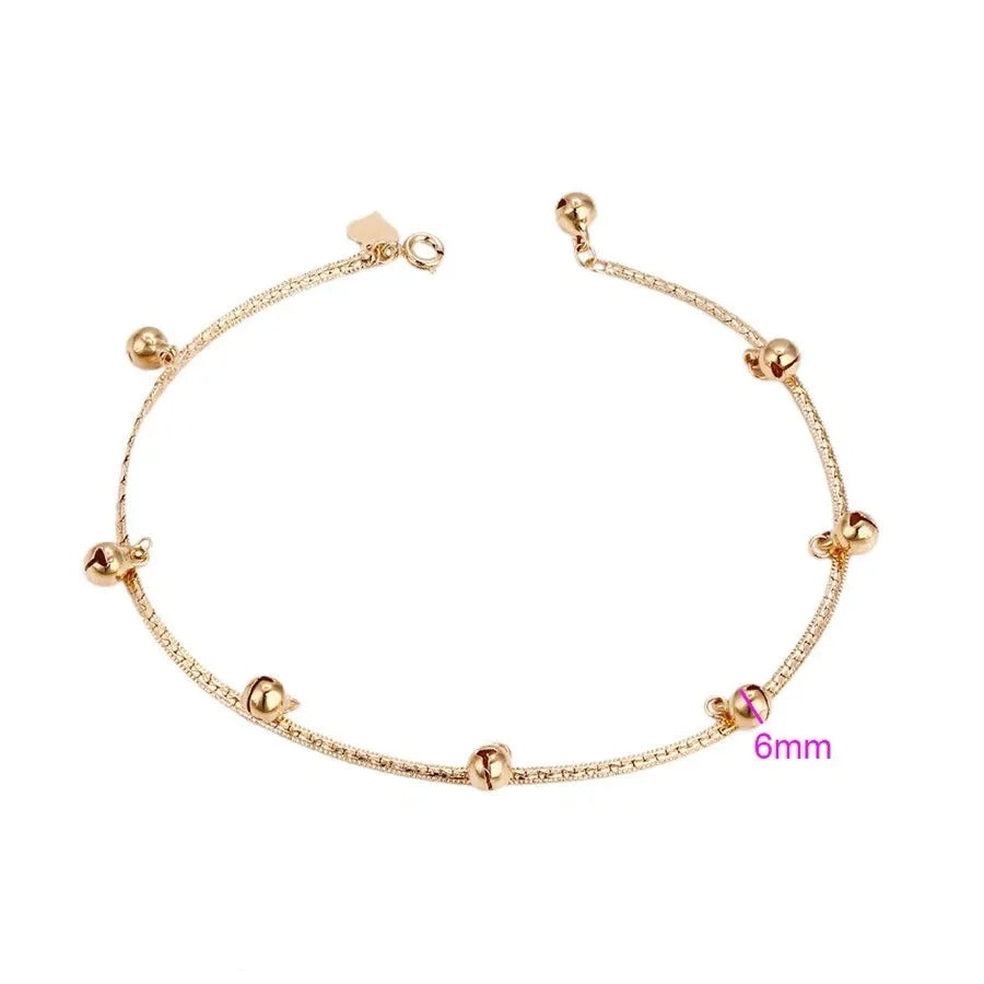 Gold  Anklet with small beads on a white background