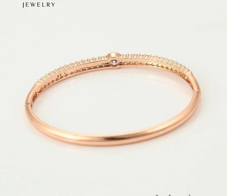 Rose gold bracelet on a white background with 'JEWELRY' text.