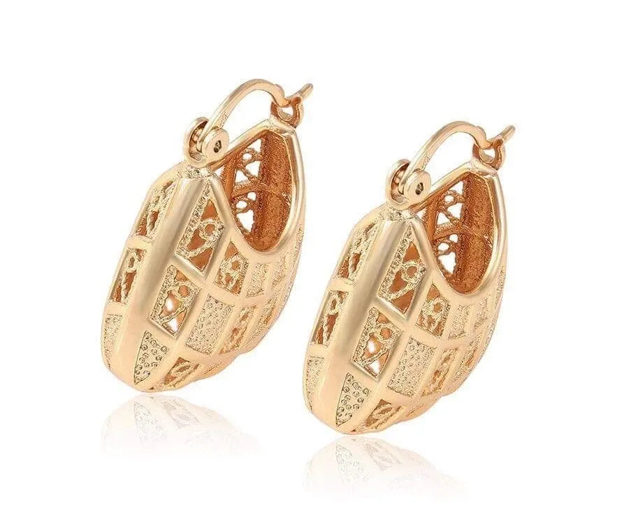 Rose gold hoop earrings with intricate designs on a white background