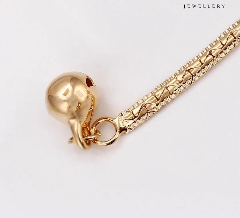 Gold  Anklet with a unique clasp design on a white background