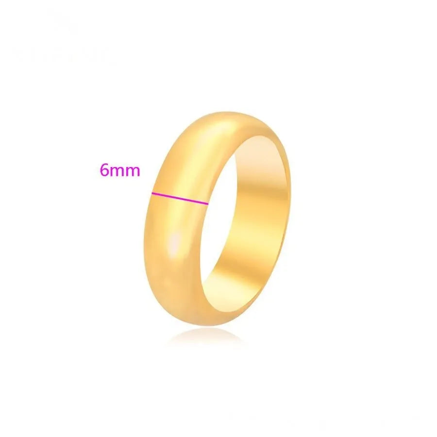 Gold ring with a width of 6mm on a white background