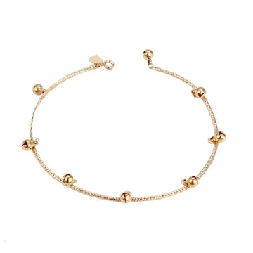 Gold  Anklet with small gold beads on a white background