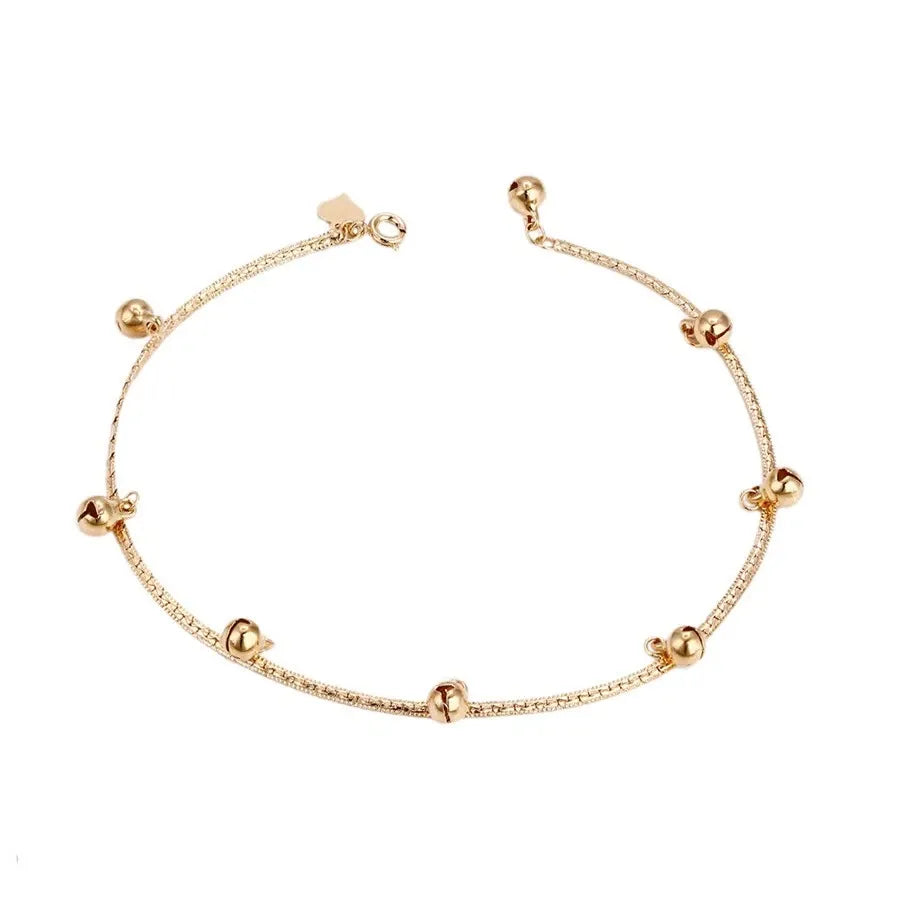 Gold  Anklet with small gold beads on a white background