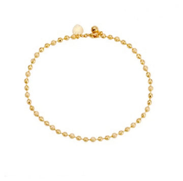 Gold beaded bracelet on a white background