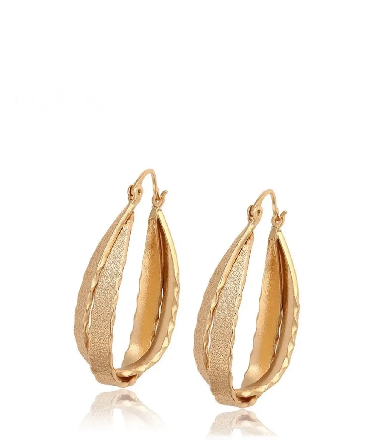 Gold hoop earrings on a white background