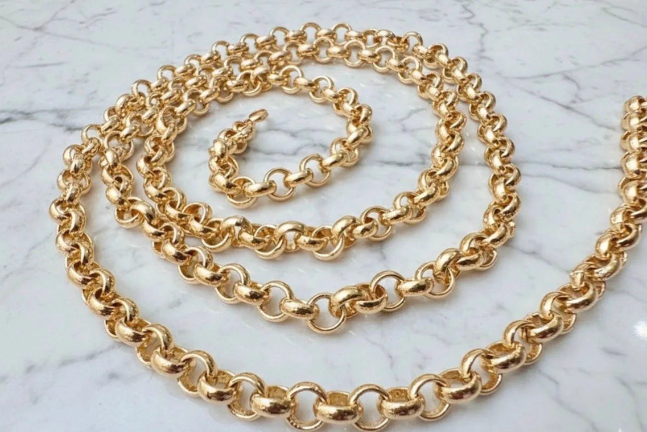Gold chain necklace on a marble surface