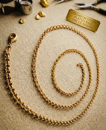 Gold chain necklace on a textured surface with a 'Premium Gold Plated' label.