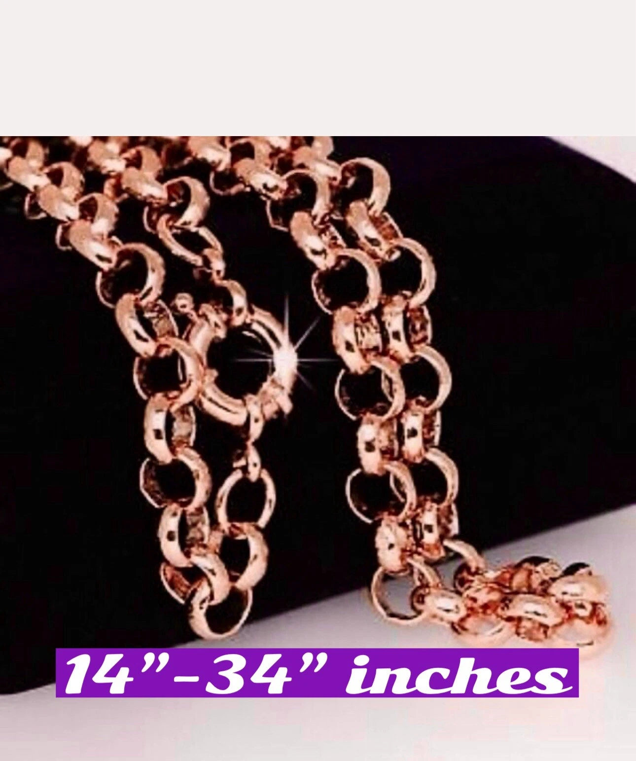 Rose gold chain with a measurement label on a dark background