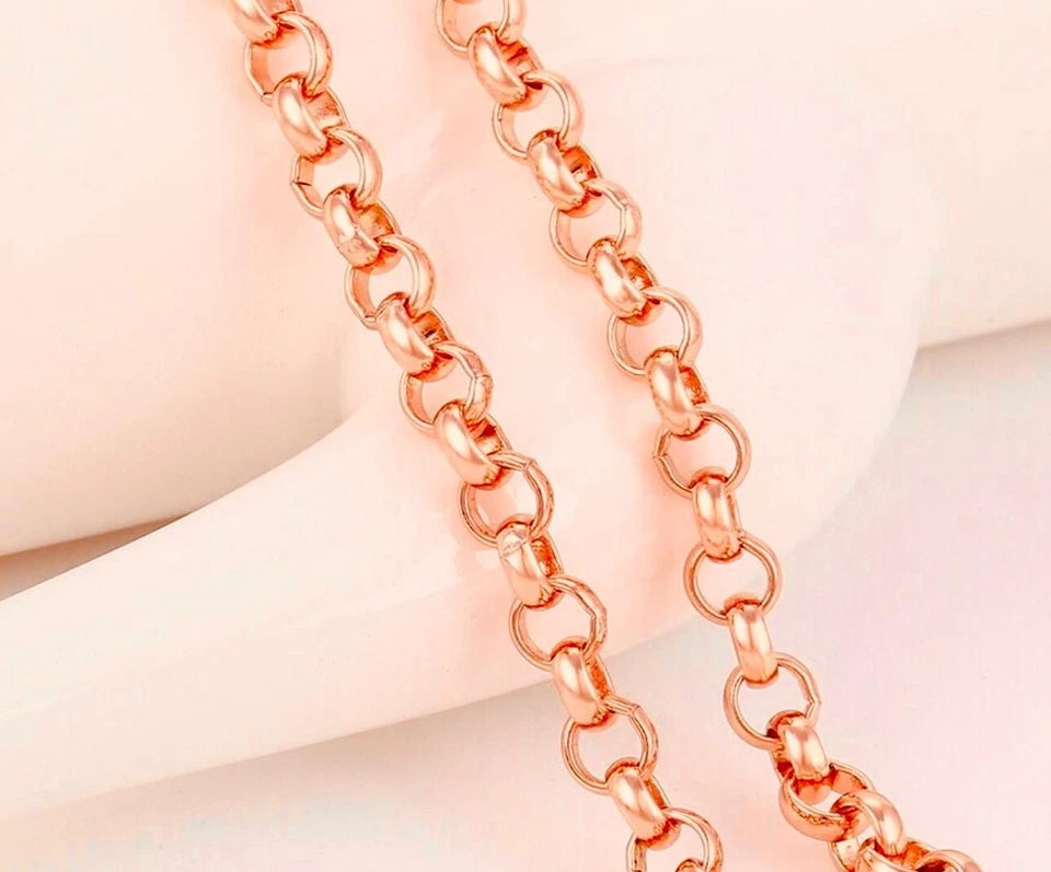 Rose gold chain on a soft pink background